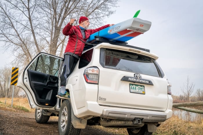 Picture showing how to put a SUP on a car rack