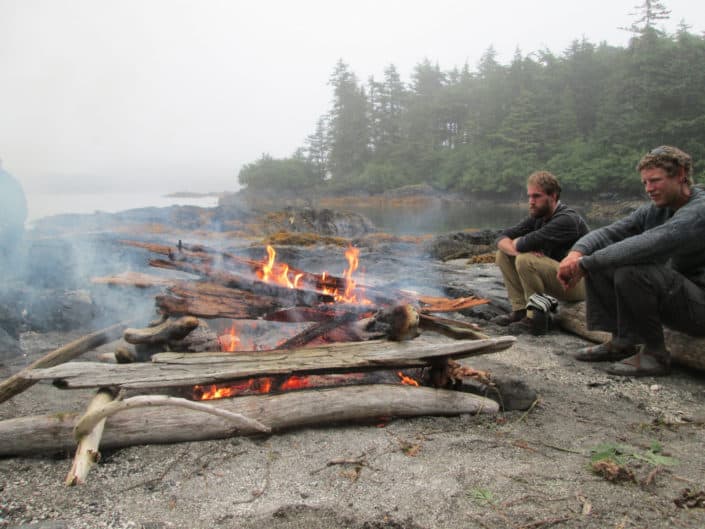 warming by the campfire after a great day kayaking